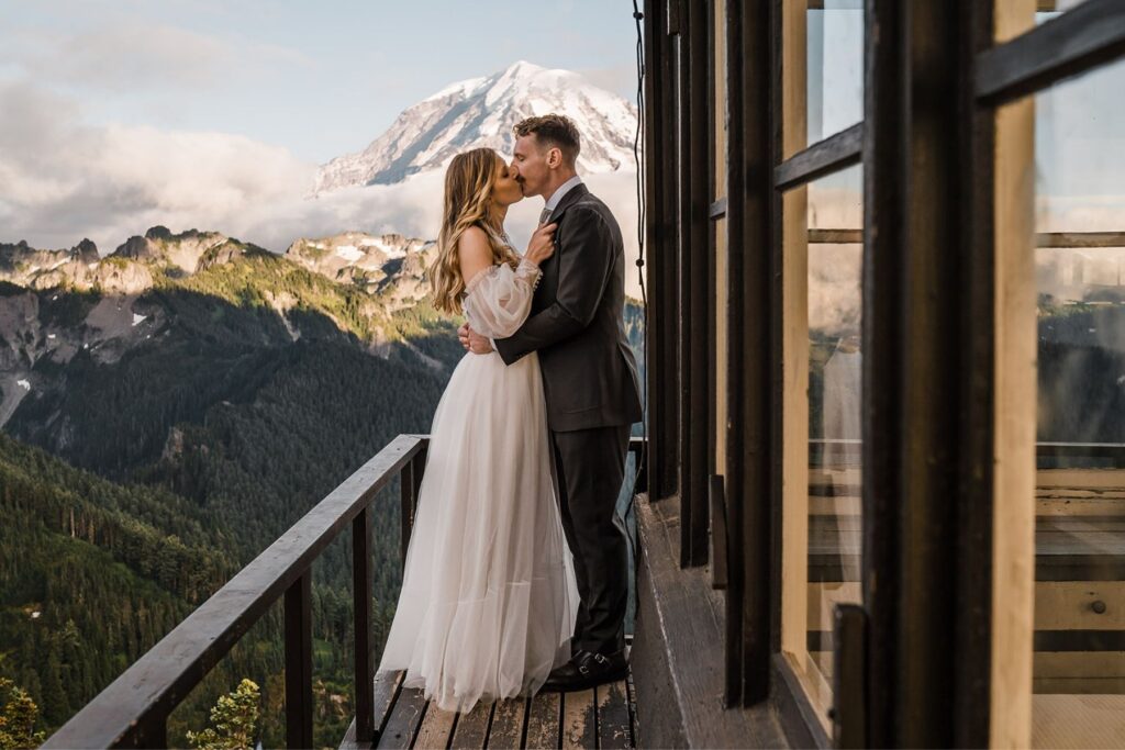 Bride and groom kiss at a fire lookout in Washington