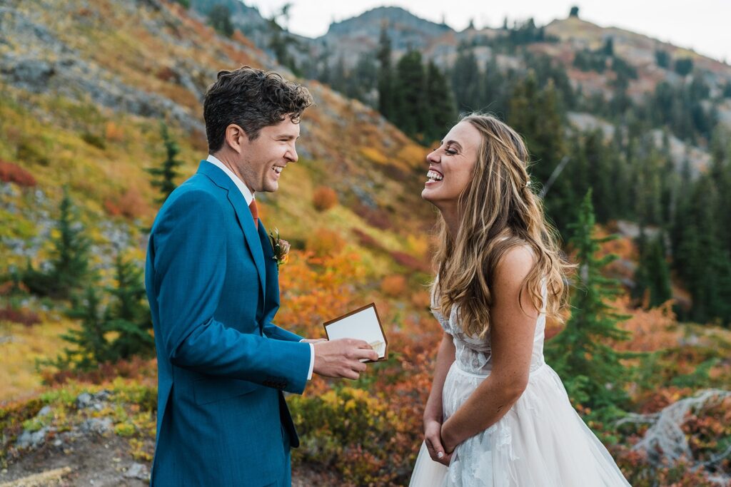 Bride and groom laugh during their elopement ceremony vow exchange in Snoqualmie Valley