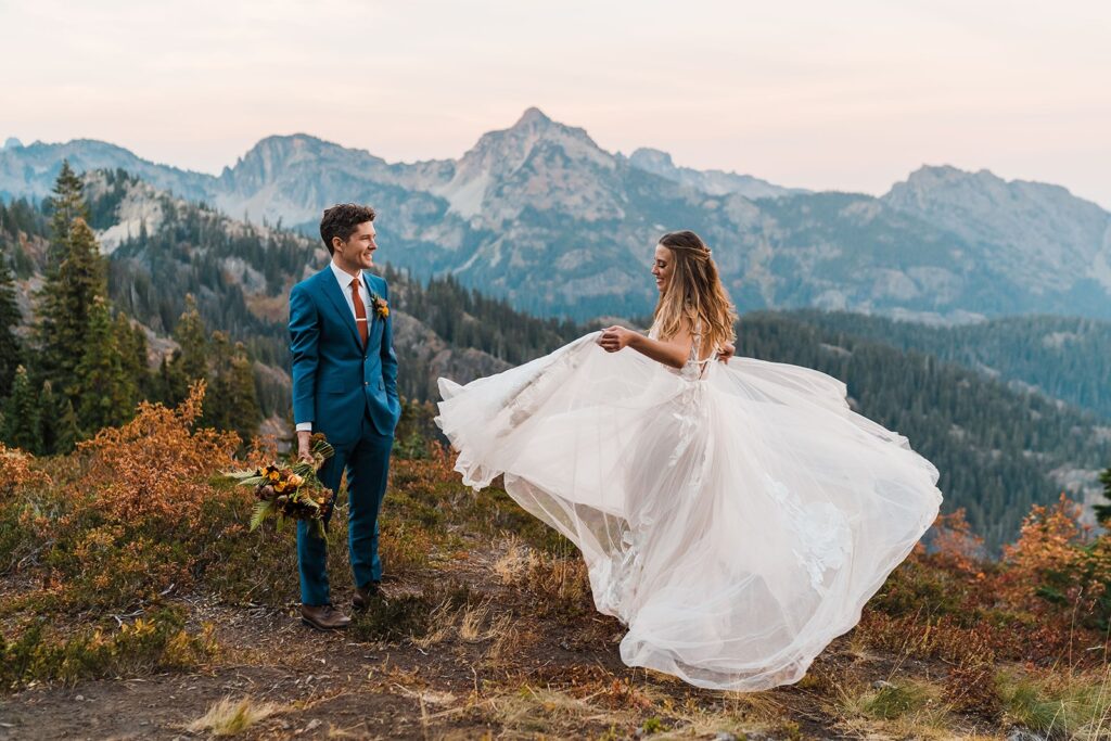 Bride dancing in the mountains during sunset portraits 