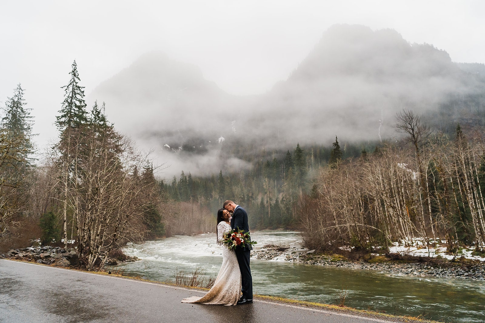 Bride and groom kiss on the side of the road during their Snoqualmie, Washington State elopement