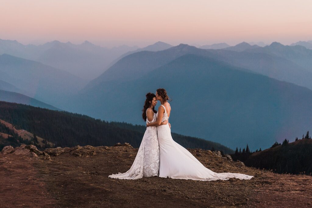 Two brides kiss at Hurricane Ridge during their mountain elopement in Washington