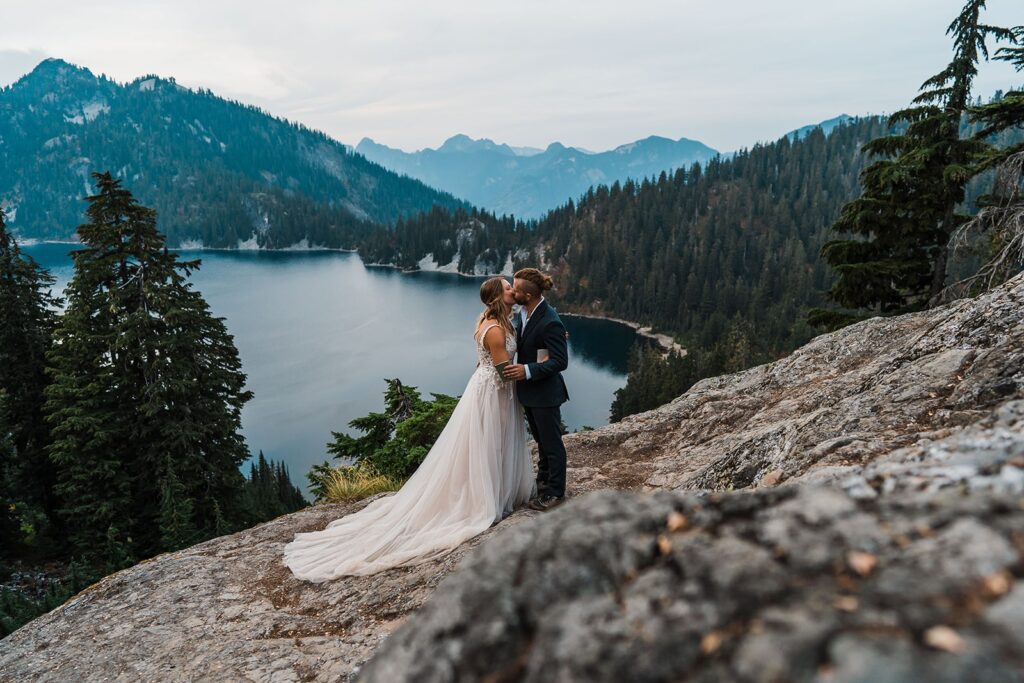 Bride and groom kiss during mountain elopement in Snoqualmie, Washington