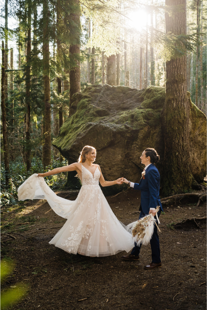 Brides dance in the forest at their adventure wedding in Snoqualmie