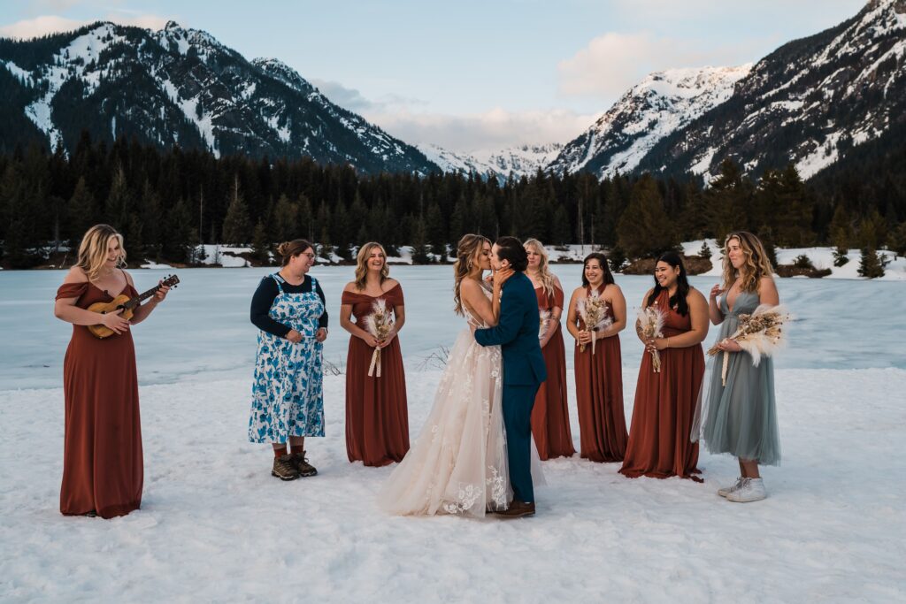 Brides kiss during first dance in the snow