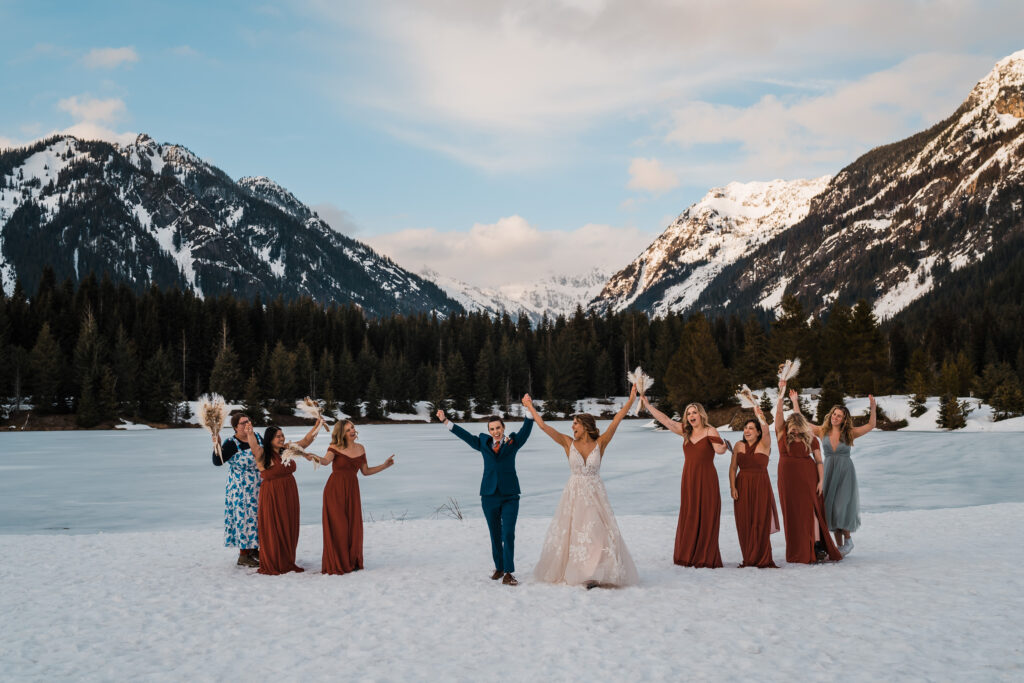 Brides and guests cheer after adventure wedding ceremony in Snoqualmie
