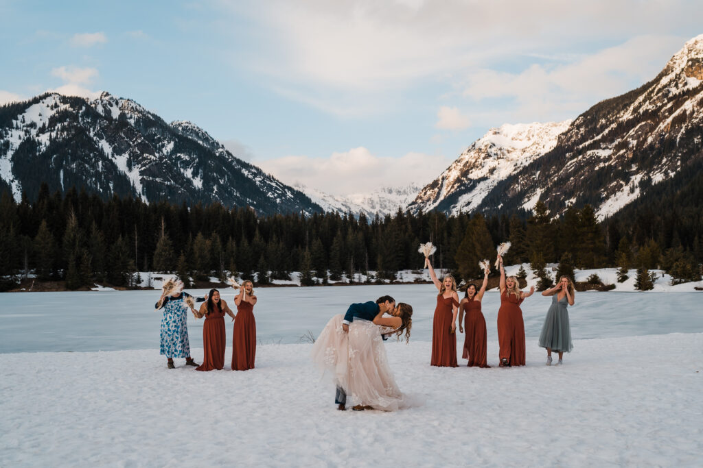 Brides dip for a kiss while after adventure wedding ceremony in Snoqualmie