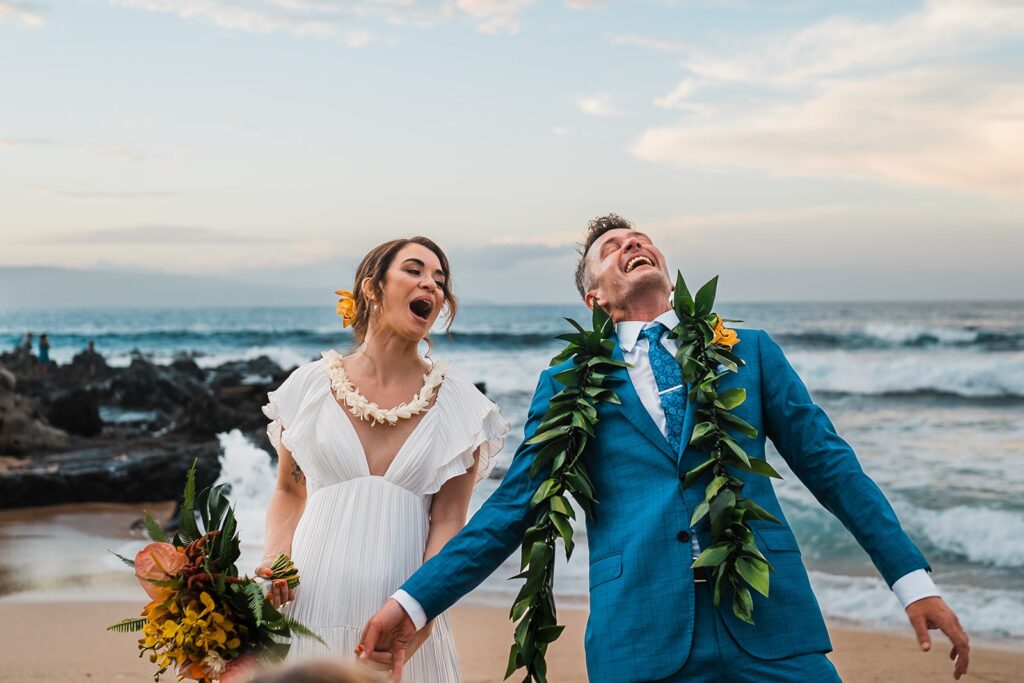Bride and groom are excited after intimate beach elopement in Maui