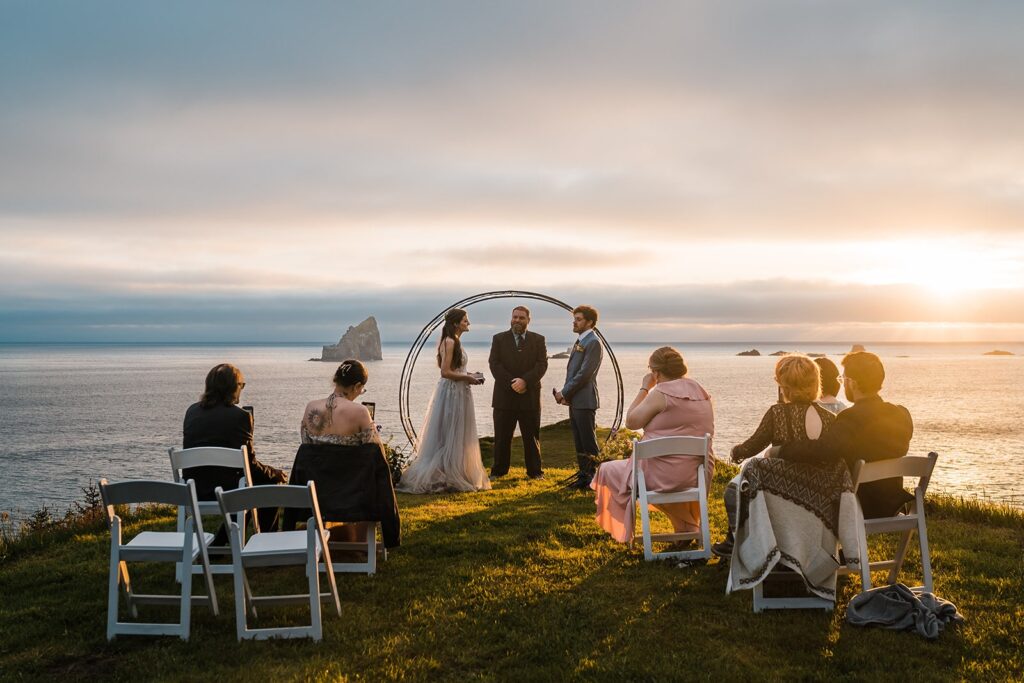 Bride and groom exchange vows during a sunset elopement ceremony at Crook Point