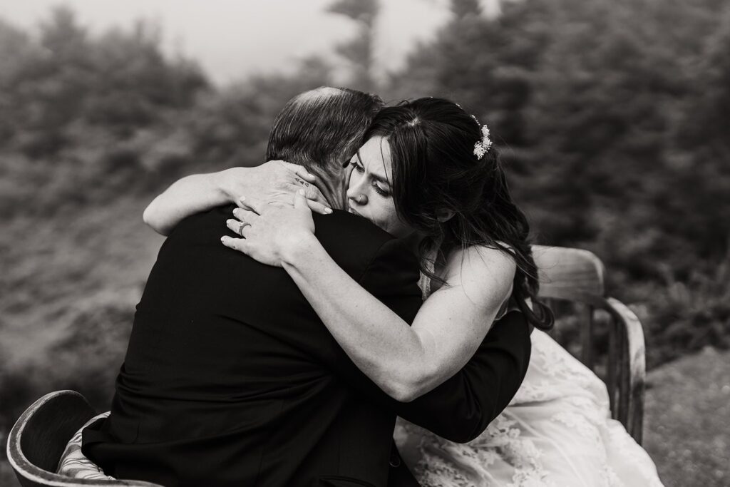Bride hugs family member before elopement ceremony on the Oregon Coast