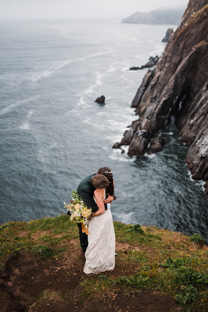 Bride and groom hug during their elopement on the Oregon Coast 