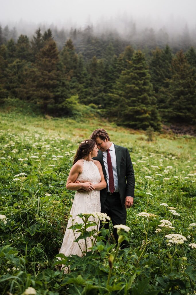 Sunset elopement photos in a field on the Oregon Coast 