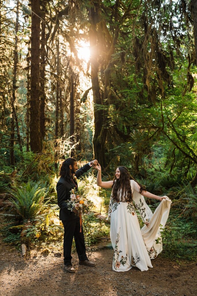 Bride and groom dance in the forest after their Hoh Rainforest elopement