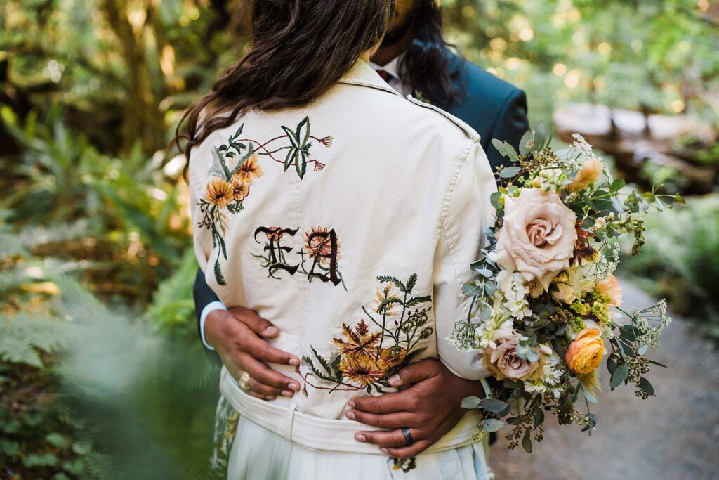 Bride wearing custom embroidered white leather jacket