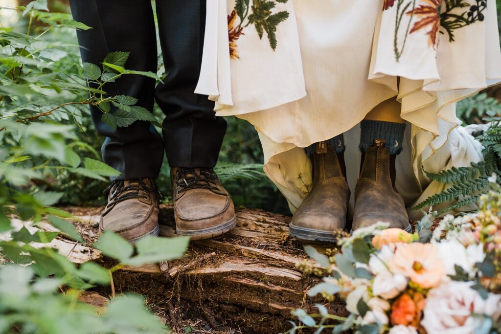 Bride and groom wearing brown leather hiking boots at their Hoh Rainforest wedding