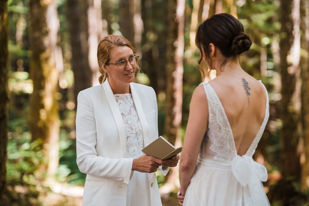 Brides exchange vows in the forest at their Olympic National Park wedding
