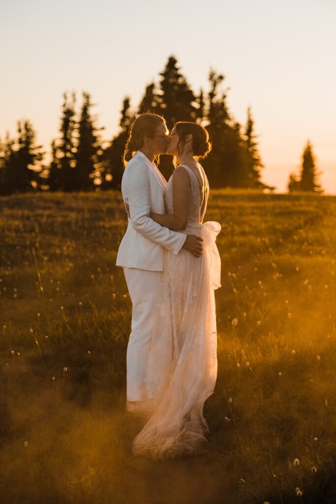 Brides kiss during sunset wedding photos in Olympic National Park 