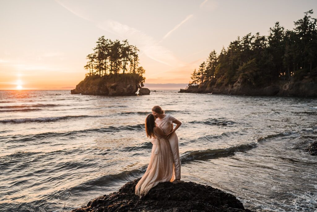 Brides kiss during their beach wedding photos at Olympic National Park