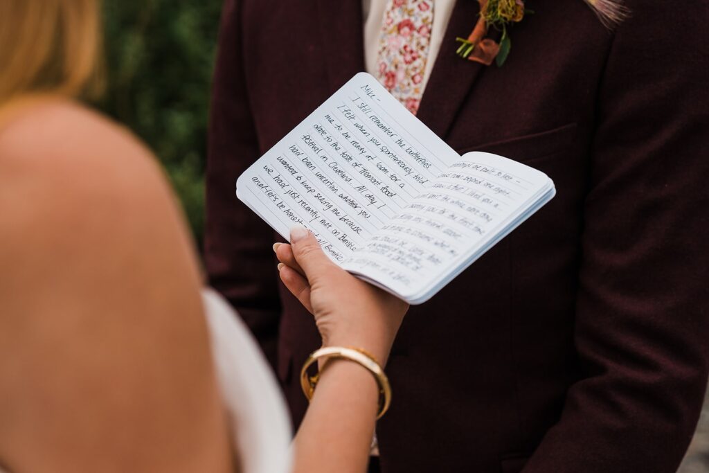 Bride reads handwritten vows during elopement in Alaska