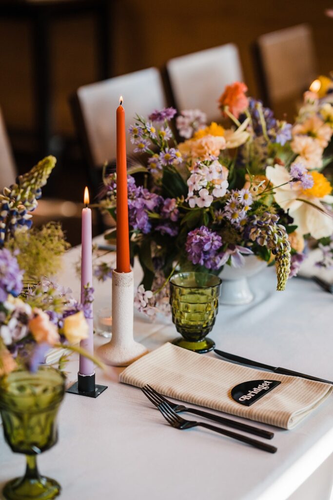 Colorful wildflowers and candlesticks at Alaska elopement
