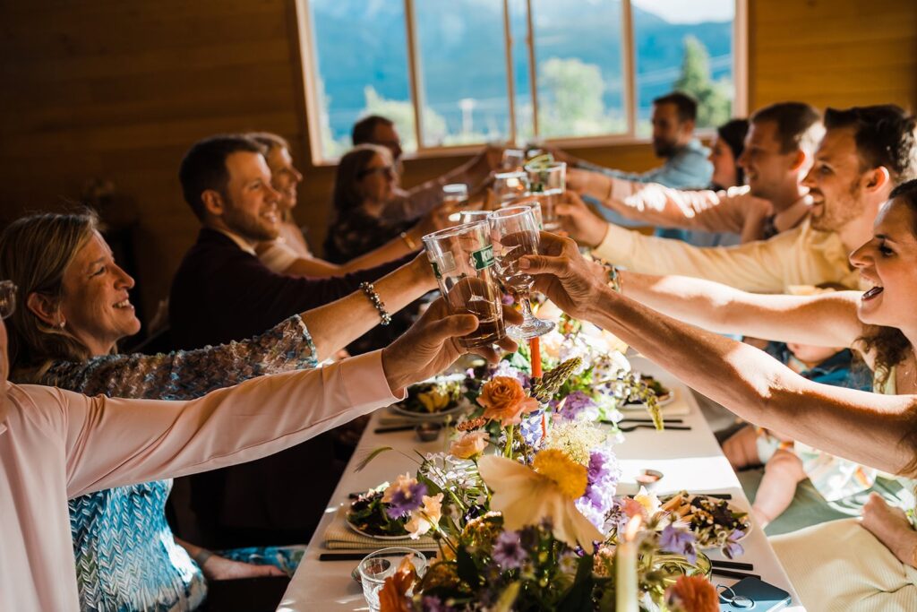 Guests toast during elopement reception in Alaska