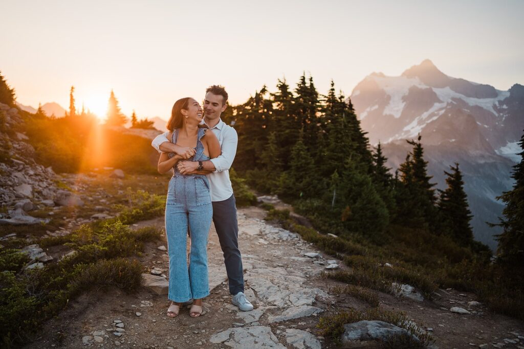 Bride and groom hug on a hiking trail at Artist Point during their sunrise elopement photos