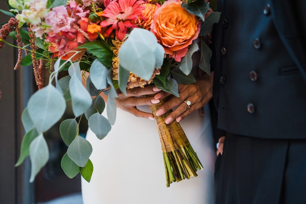 Bride holding colorful flower bouquet at North Cascades elopement