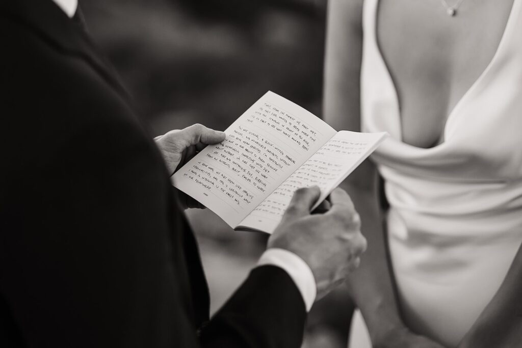 Groom reads personal vows to bride during their Artist Point elopement ceremony