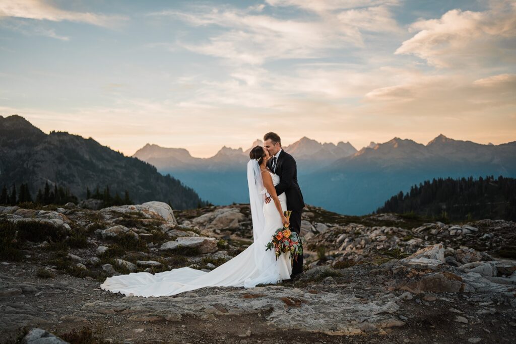 Bride and groom kiss in the mountains during their Artist Point elopement photos