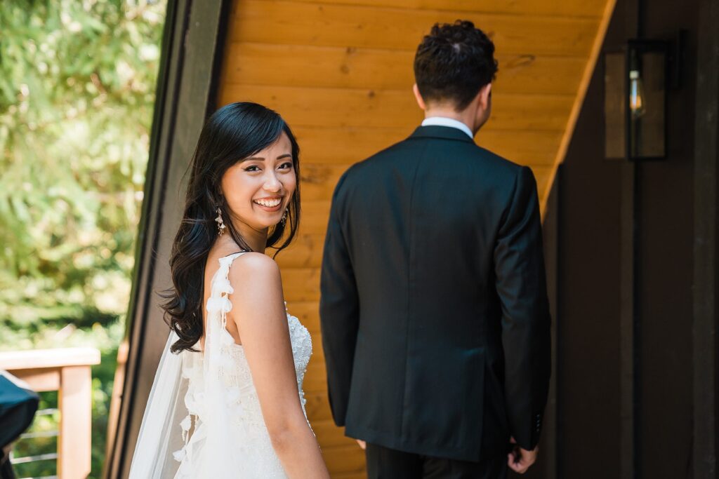Bride and groom first look at A-Frame cabin in Washington