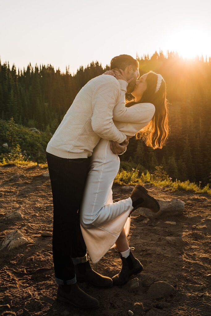 Bride and groom kiss during their sunrise elopement photos at Mt Rainier