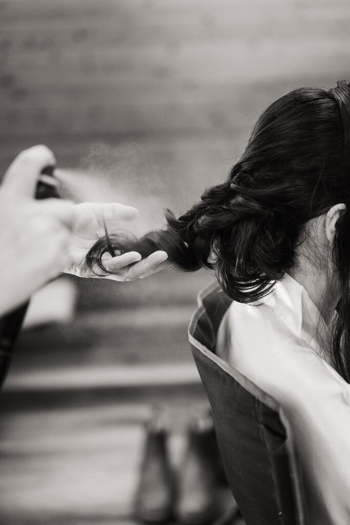 Bride getting hair done for alpine lake elopement