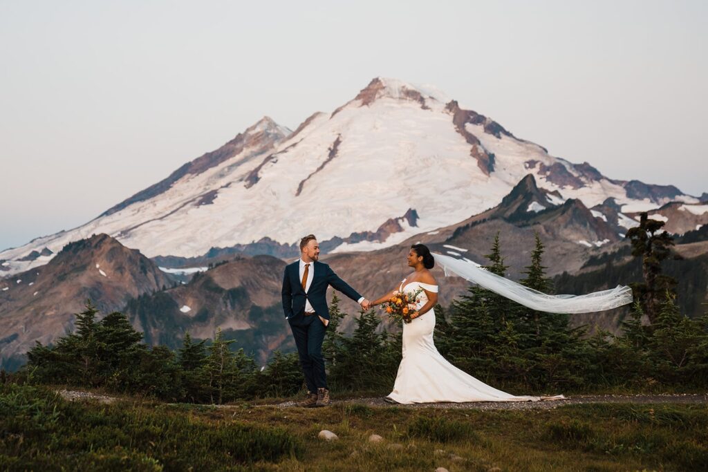 Bride's veil blows in the wind during sunset elopement photos in the North Cascades