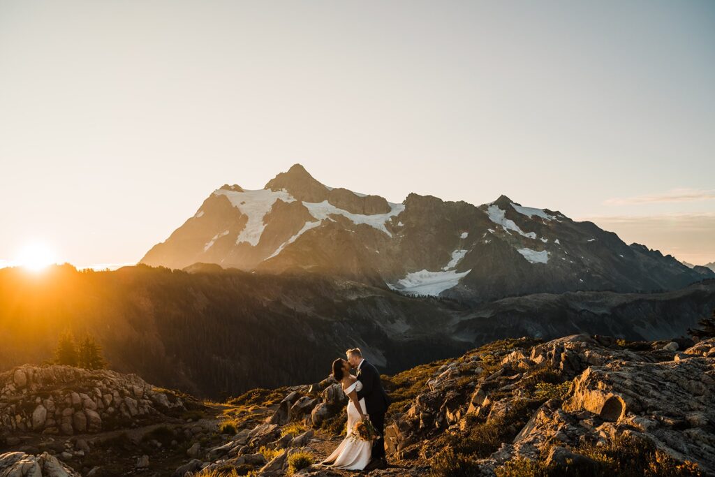 Bride and groom kiss during sunrise elopement photos at Artist Point