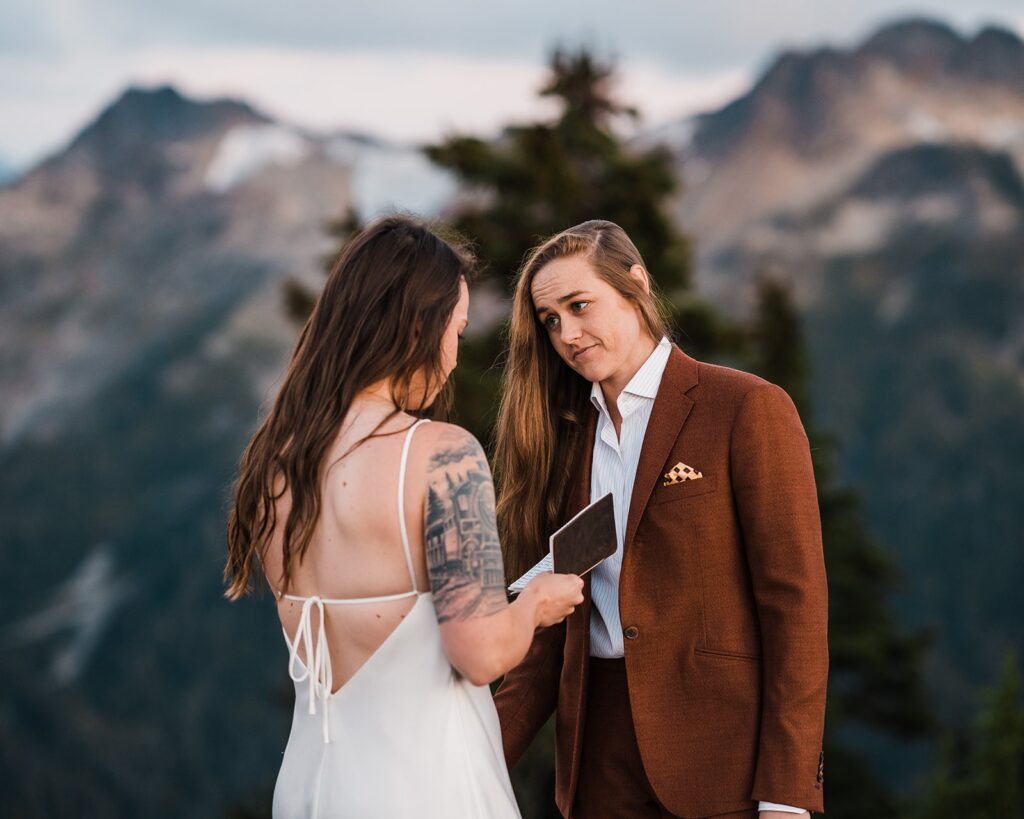 Brides exchange private vows during their North Cascades wedding