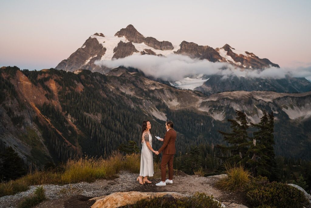 Brides exchange private vows during their North Cascades wedding