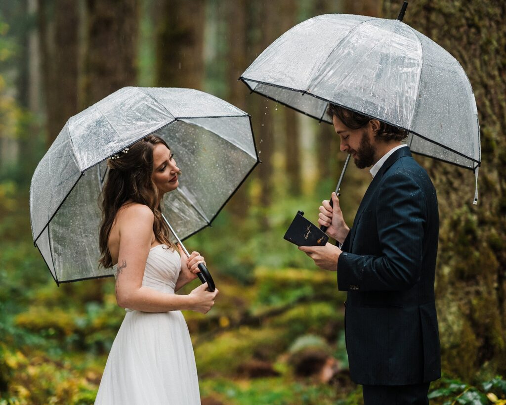 Groom reads personal vows to bride during their romantic forest elopement ceremony in Snoqualmie