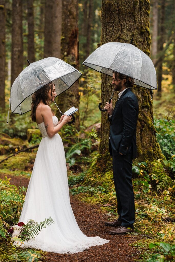Bride reads vows to groom during their elopement ceremony in Snoqualmie