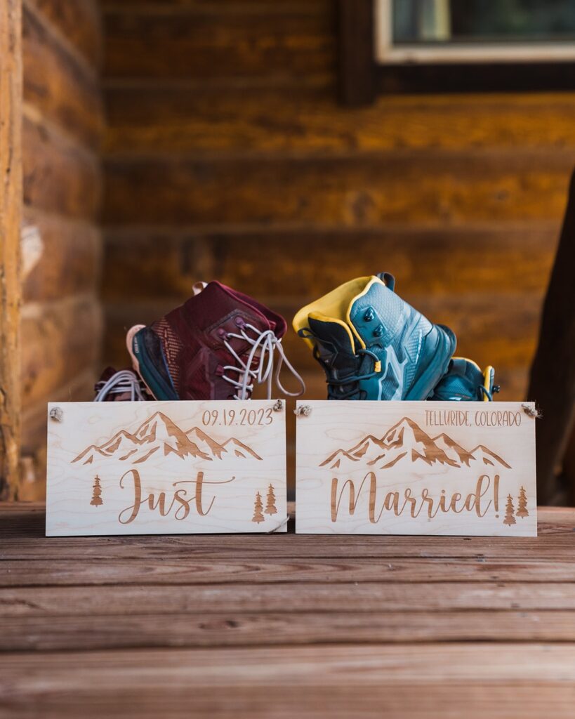 Just married wood sign with blue and burgundy hiking boots