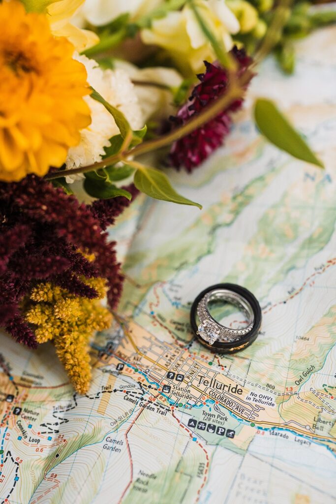 Wedding rings laying on a map of Telluride