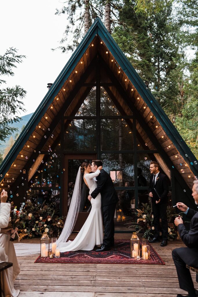 Bride and groom kiss during their Airbnb wedding in Washington