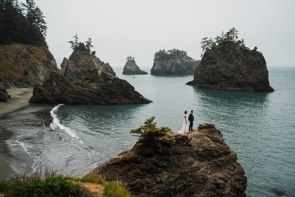 Bride and groom hold hands during their Oregon elopement on the southern Oregon coast