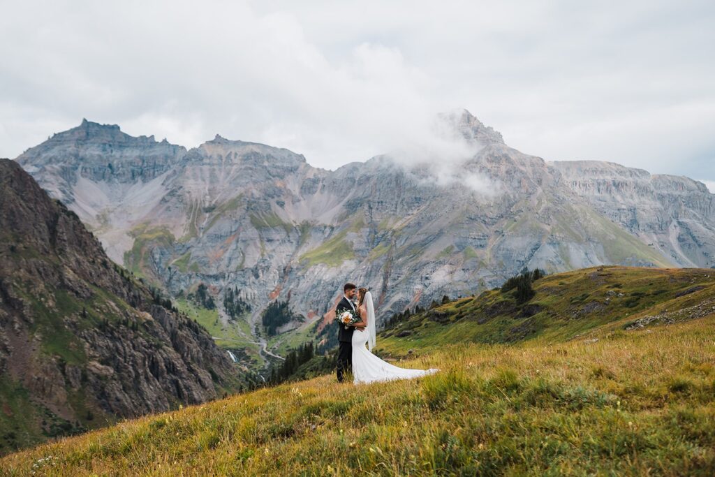 Bride and groom kiss during their Rocky Mountain National Park elopement