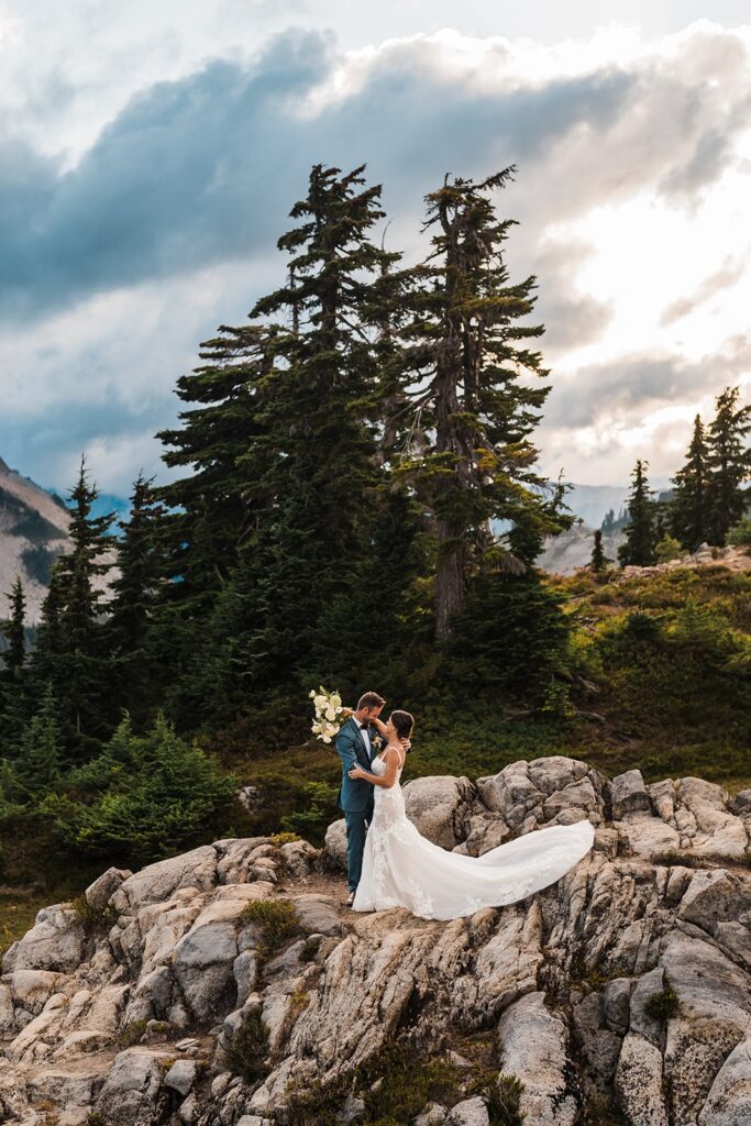 Bride and groom hug during their Washington micro wedding photos in the North Cascades
