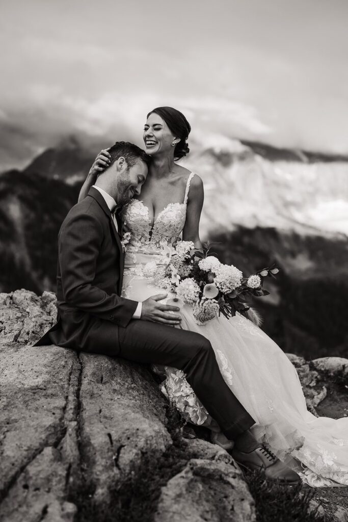 Bride laughs during Washington micro wedding photos in the mountains