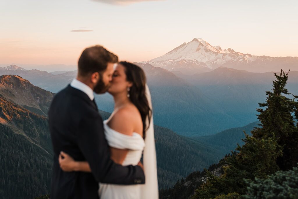 Bride and groom kiss at their North Cascades elopement in the mountains