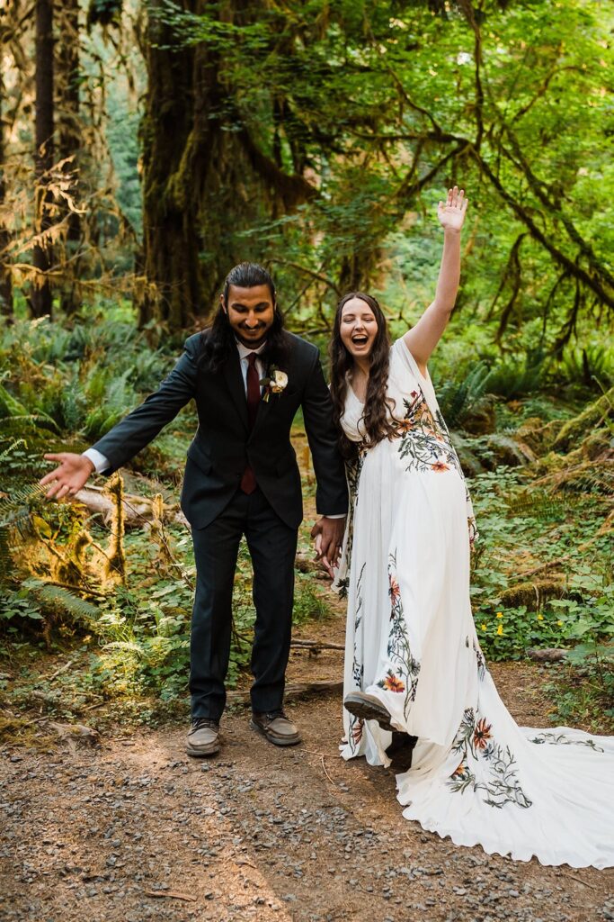 Bride and groom cheer during their elopement in Olympic National Park