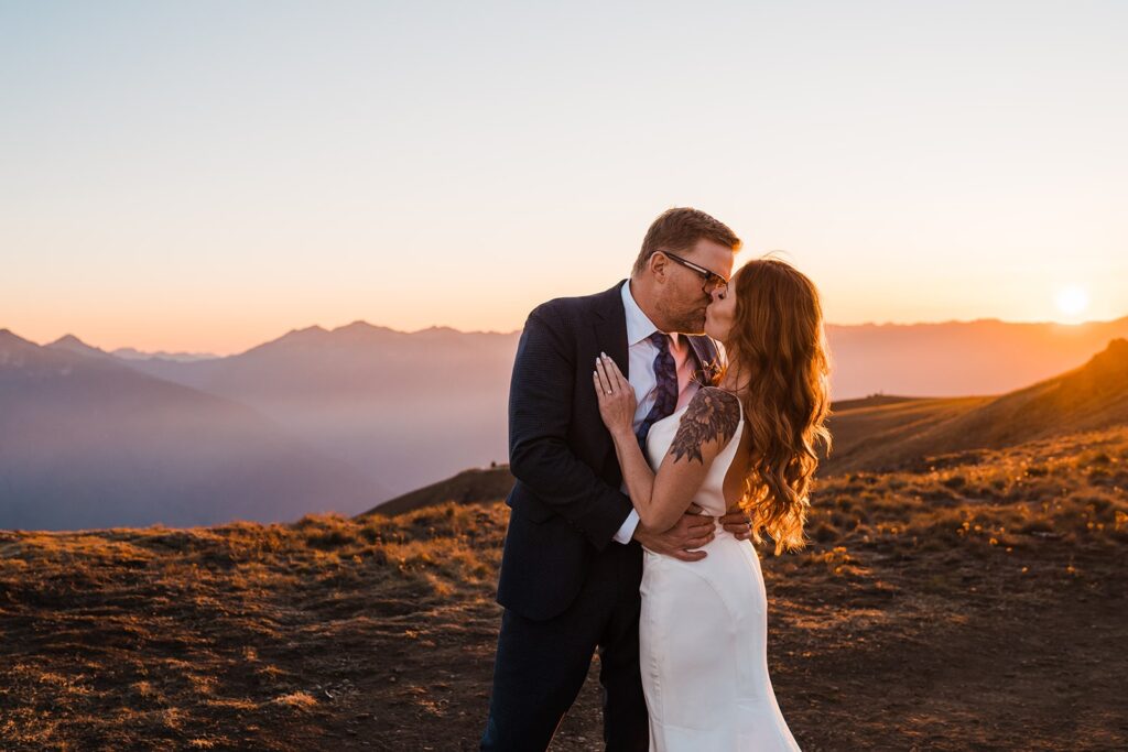 Bride and groom kiss during their elopement in the mountains in Olympic National Park