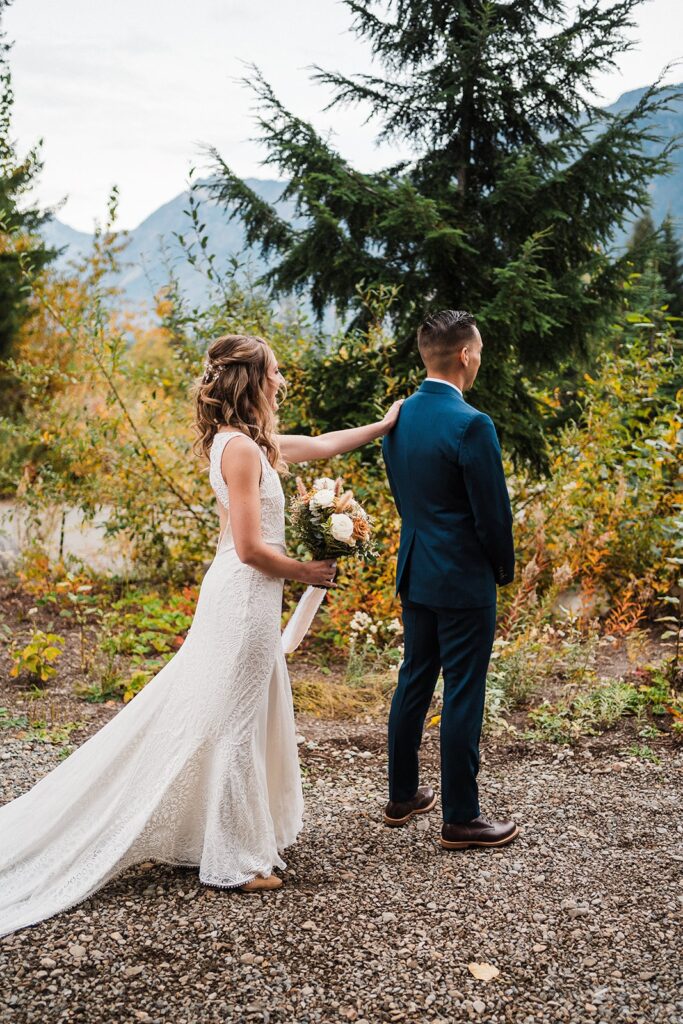 Bride and groom first look at their Pacific Northwest elopement in Snoqualmie