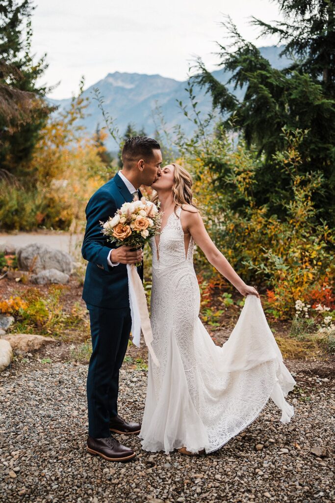 Bride and groom kiss after their first look at their elopement in Snoqualmie