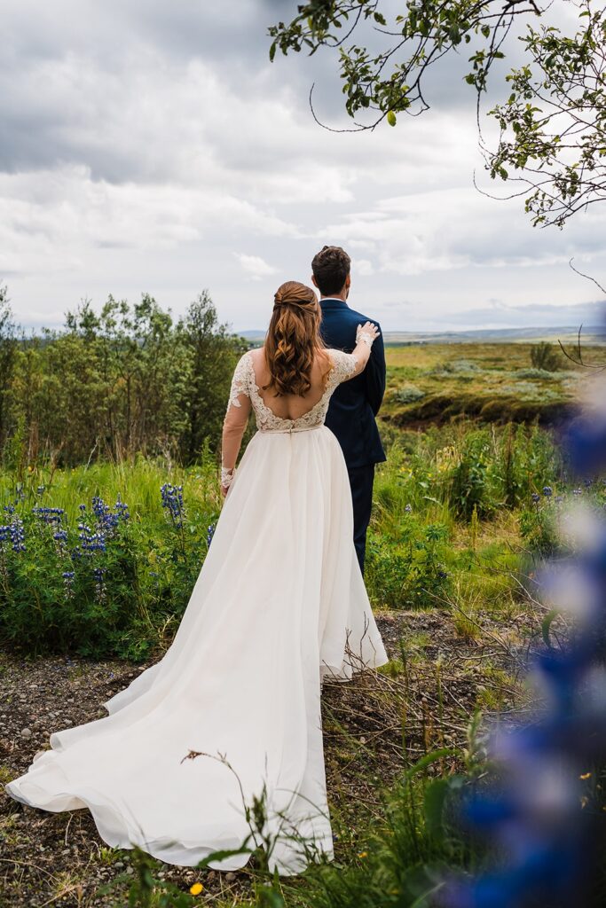 Bride tapping groom on the shoulder for their elopement first look in Iceland